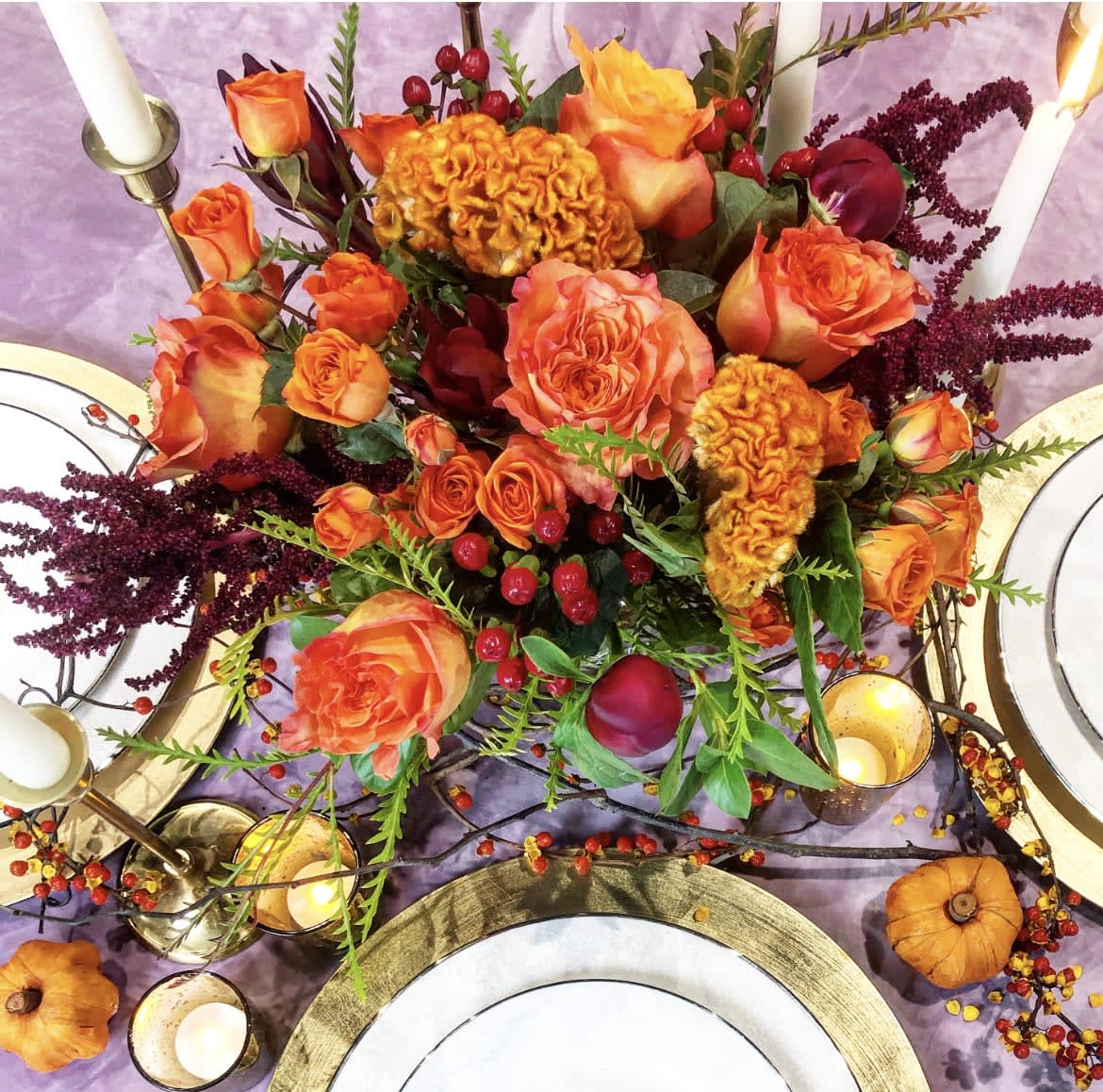 It's All Gravy Centerpiece - A fresh and festive floral centerpiece made up of florals which may include roses, peonies, celosia, and other beautifully toned elements.
