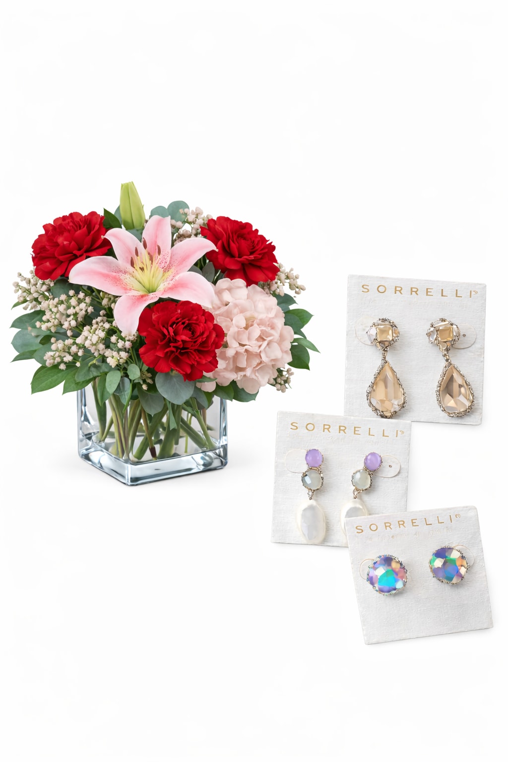Eternal Elegance Package - Package Options  Standard Eternal Elegance – $199 • Modern clear cube vase • 1 red rose • Pink lily • Red carnations • Baby’s breath &amp; fresh greenery • Choice of Sorrelli earrings  A refined and thoughtful expression of love.  ⸻   Deluxe Eternal Elegance – $225 • Larger modern cube arrangement • 3 red roses • Pink lily • Lush hydrangea • Fresh greenery &amp; accents • Choice of Sorrelli earrings  Elegant, romantic, and beautifully balanced.  ⸻   Premium Eternal Elegance – $295 • Full, luxury-size modern cube arrangement • 9 red roses • Pink lilies • Abundant hydrangea • Premium greenery &amp; finishing touches • Choice of Sorrelli earrings  A stunning statement piece for unforgettable occasions. 