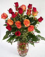 18 Long Stem Orange and Red Roses in a vase - These roses will WOW her or him! They carry the meaning of love and passion!