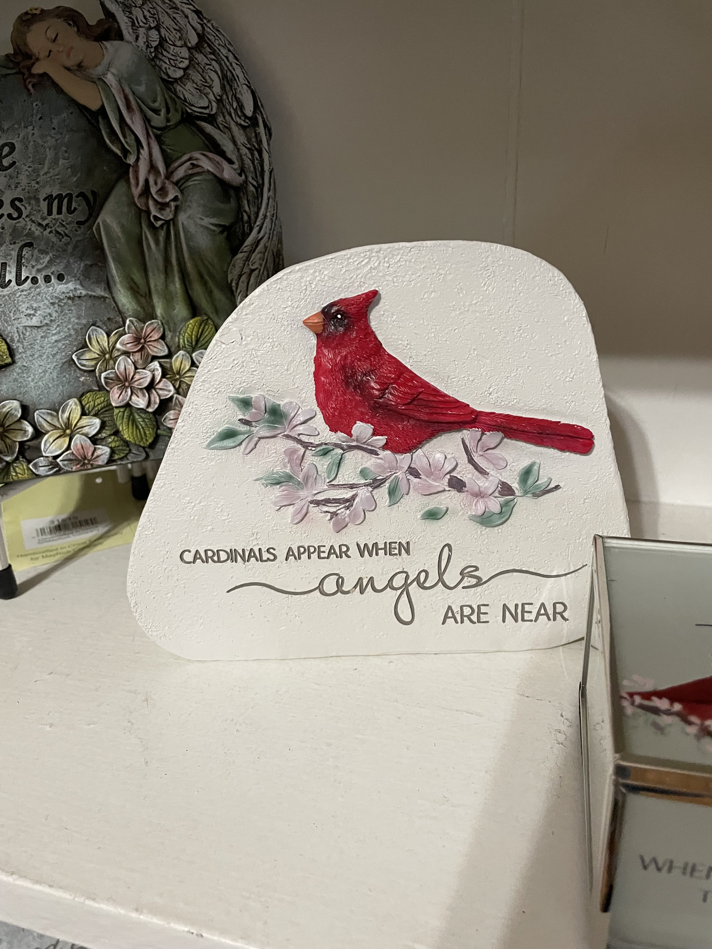 Decorative plaque with a red cardinal and floral accents