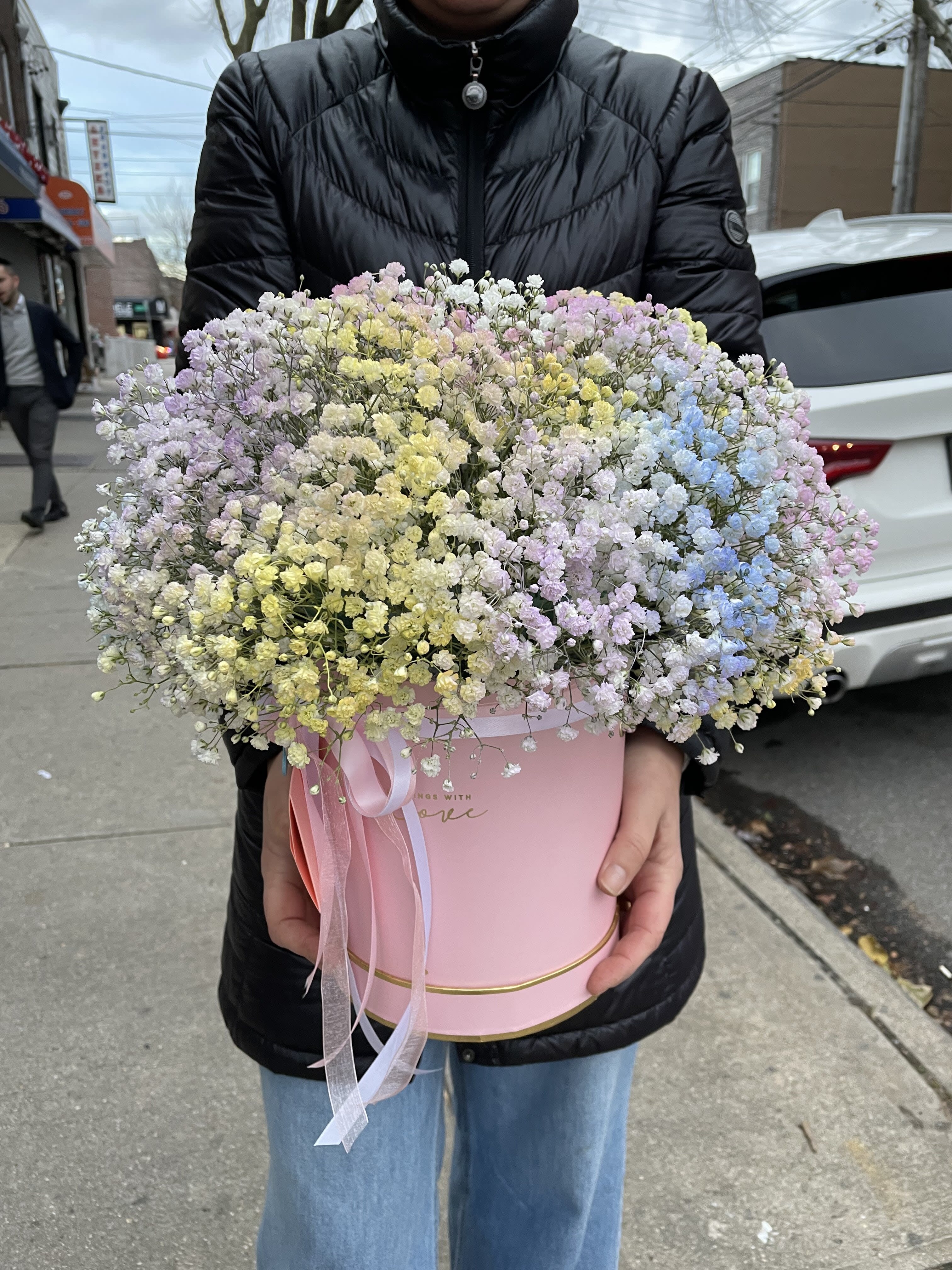 Large pastel bouquet of baby's breath in a pink hat box