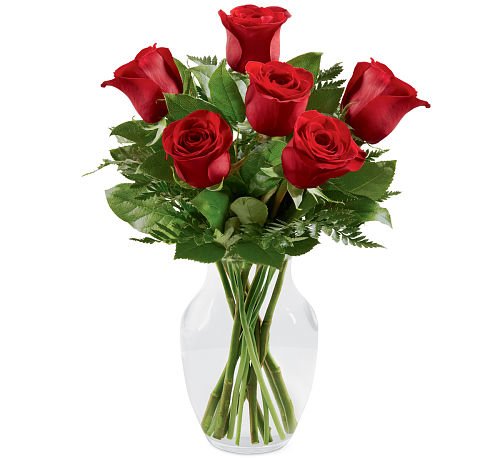 Simply Enchanting Rose Bouquet -  Rose Bouquet brings together lush red roses to make a lasting impression. Gorgeous red roses are simply accented with a variety of fresh greens and perfectly situated in a classic clear glass vase to create a flower bouquet that conveys your hearts deepest desires for love and romance.