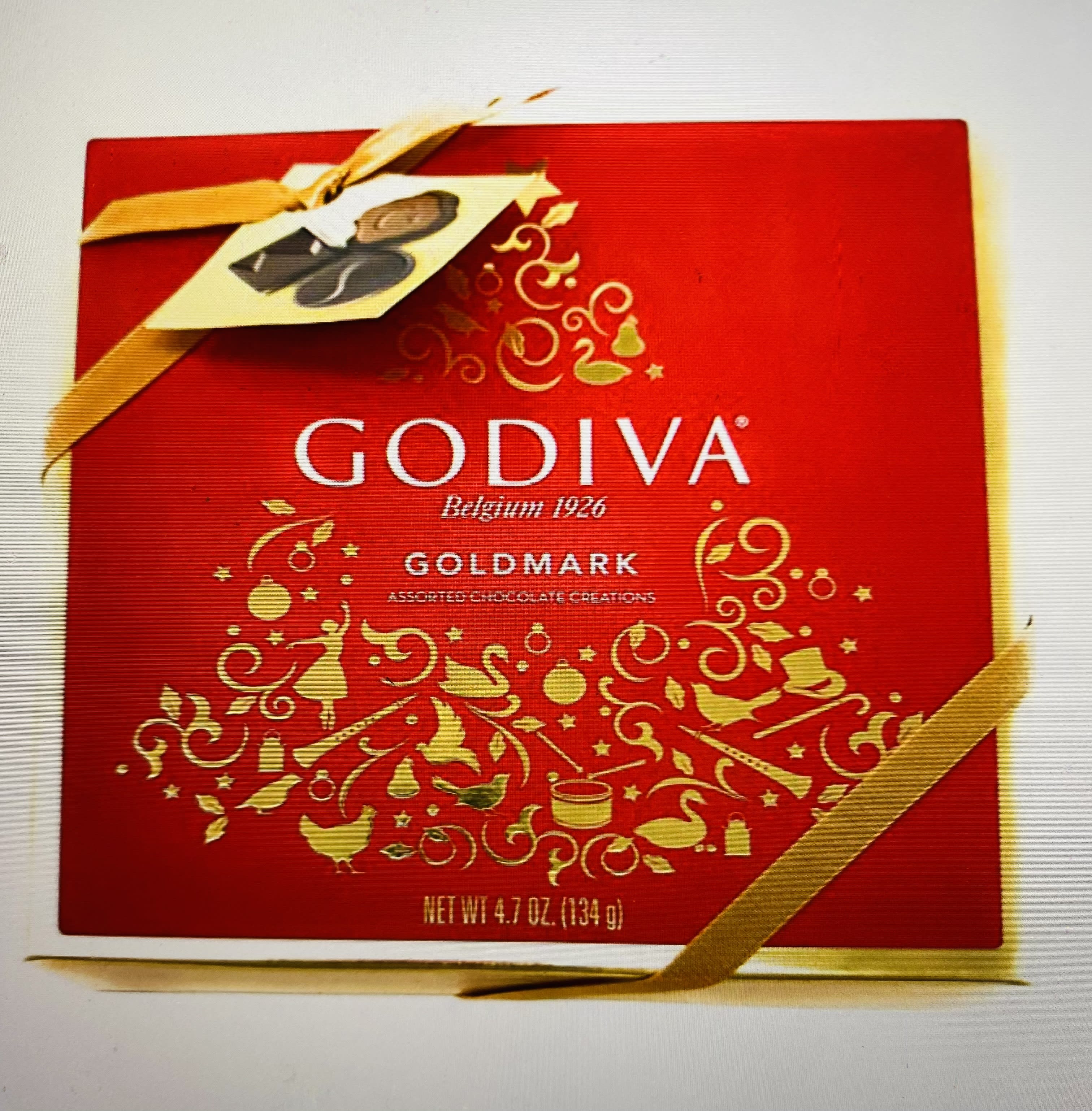 Red Godiva chocolate gift box with gold ribbon
