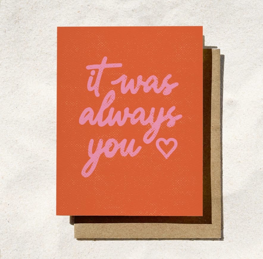 Orange greeting card with pink text reading "it was always you" and a heart