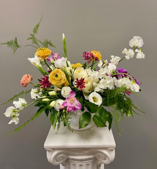 Bijou - This stylish &amp; modern design is spectacular! Arranged in a ceramic compote filled with specialty flowers including Sweet Pea, Ranunculus, &amp; Freesia.
