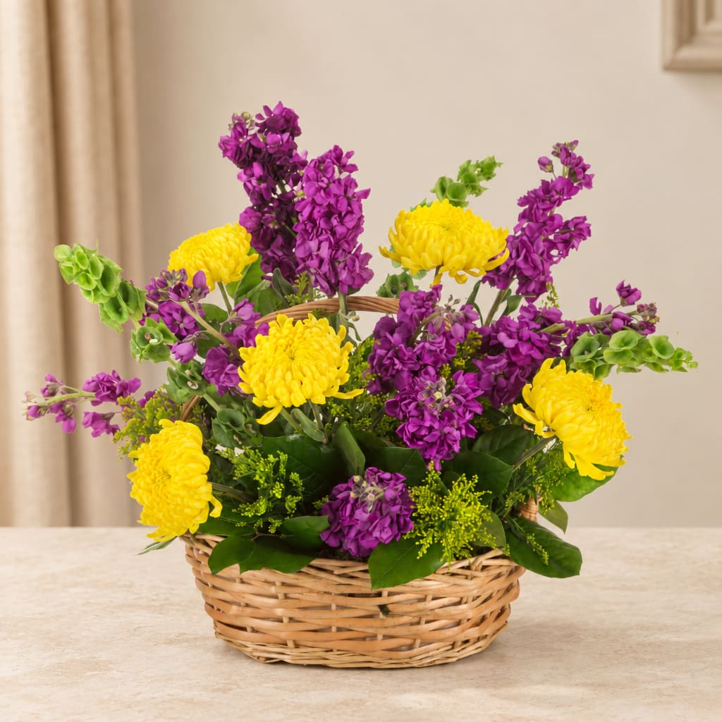 Purple and yellow flowers arranged in a wicker basket