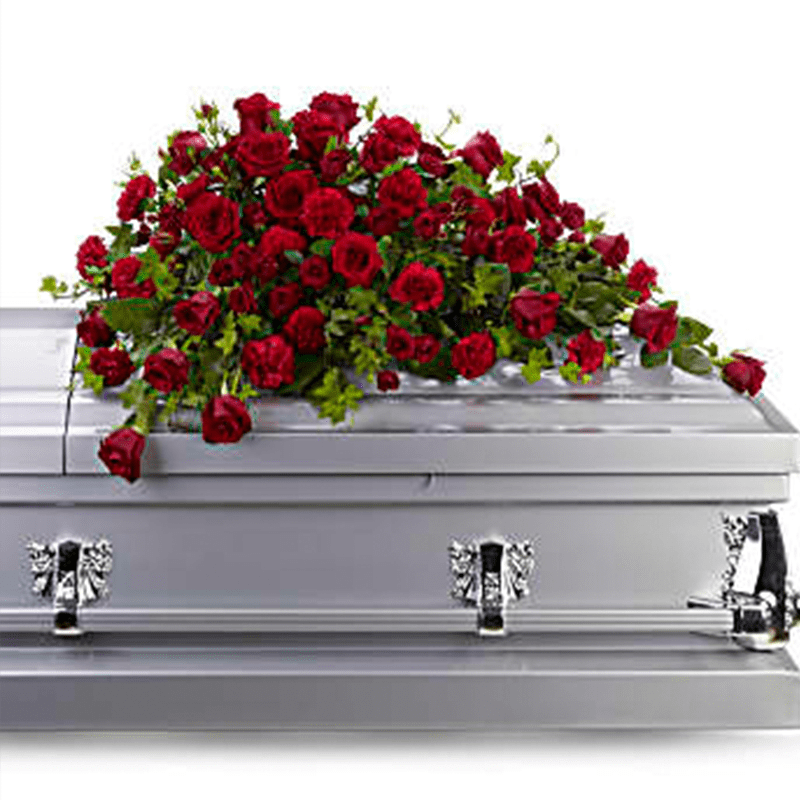 Red rose casket spray on a silver casket