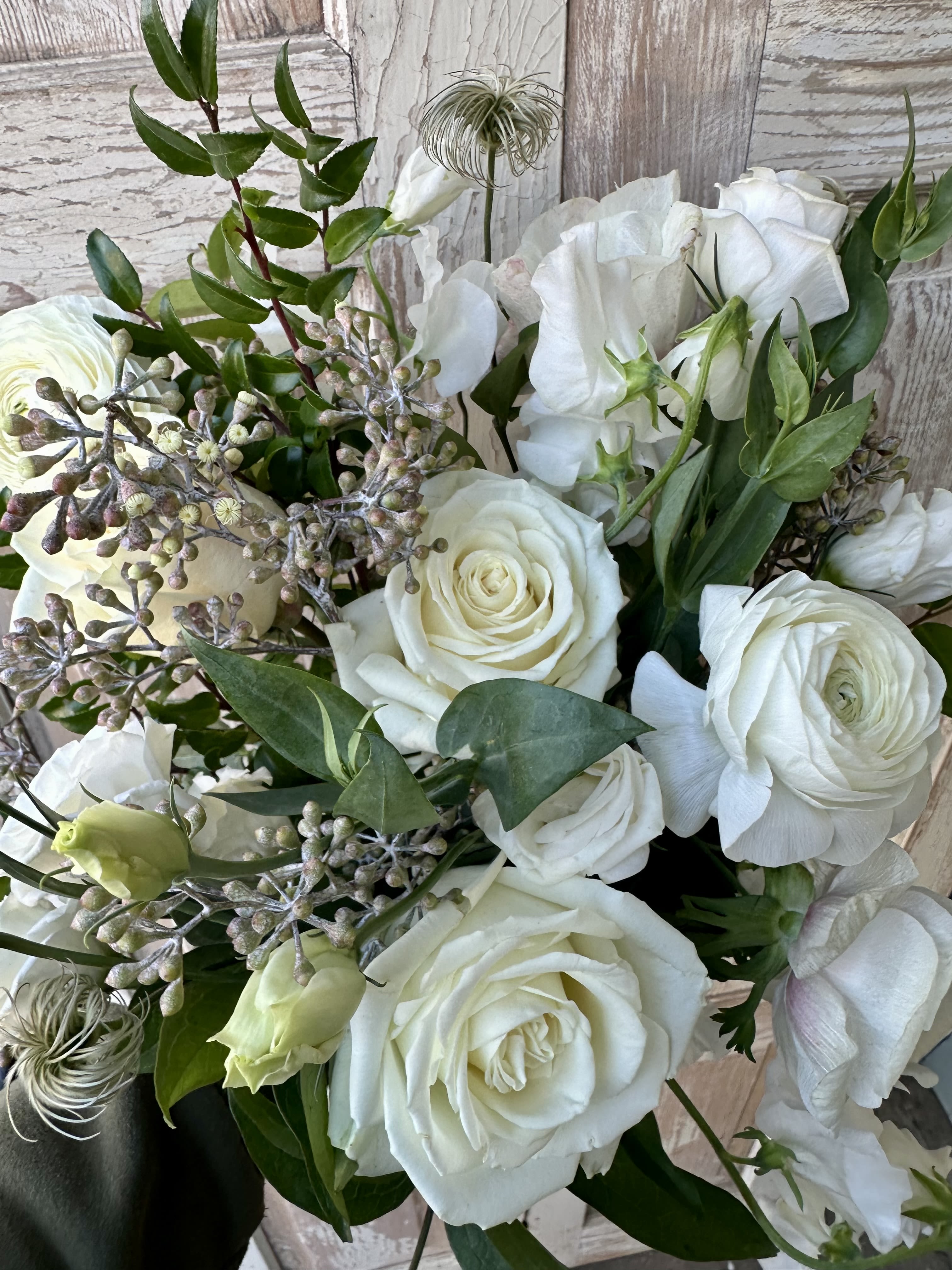 White rose bouquet with white lisianthus and greenery