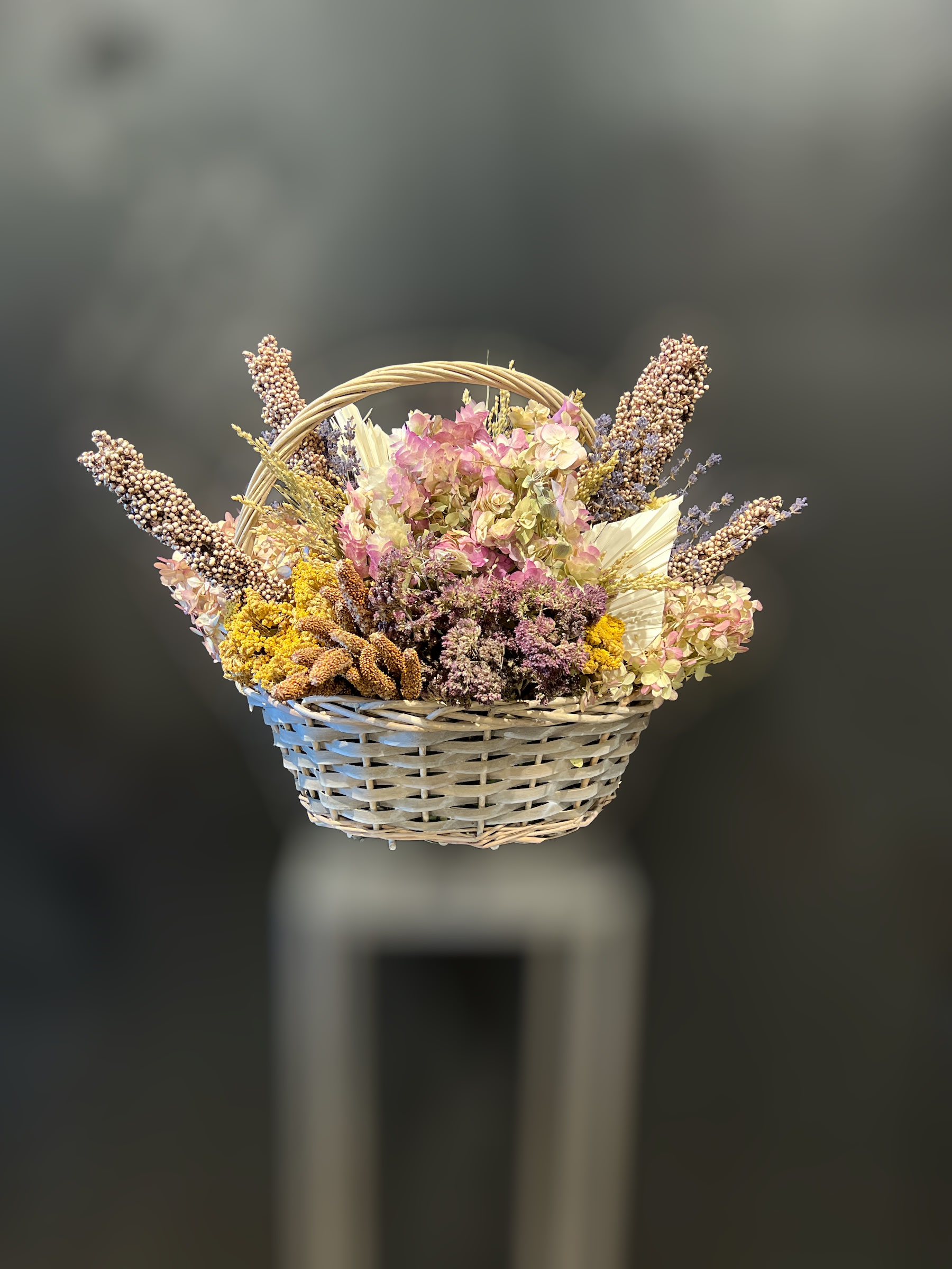 Dried and Preserved flowers in basket (containers/botanicals vary) - A wonderful variety of herbs and flowers like lavender, oregano, hydrangea, yarrow.. cones and pods too.  Handcrafted and gathered in a variety of baskets and containers.  Each design is unique but equally visually pleasing.  Approx 16x12x14