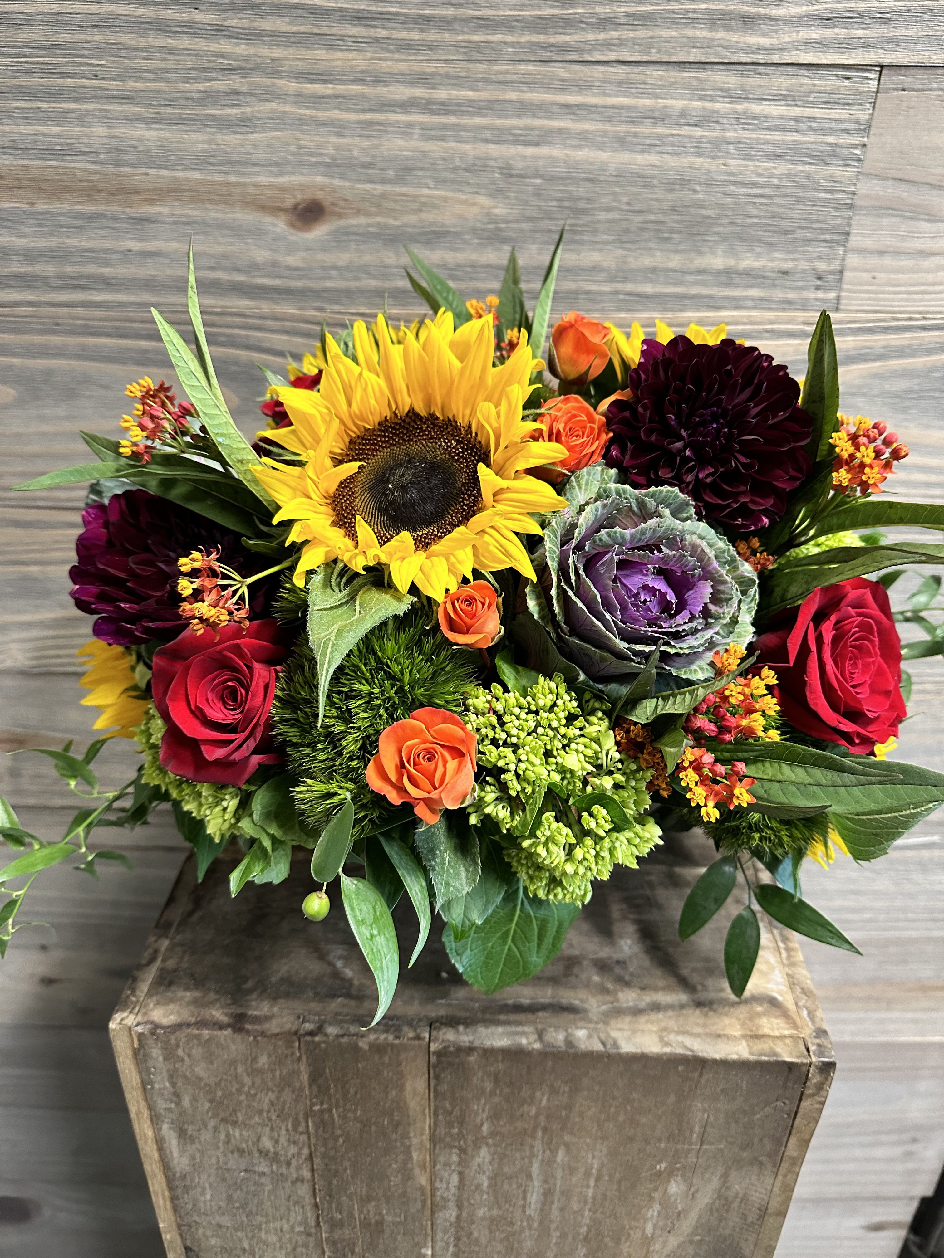 Fall Bounty - A fuller bouquet of fall favorites of sunflowers, kale, spray roses, dahlias, roses, hydrangeas, asclepsia etc.