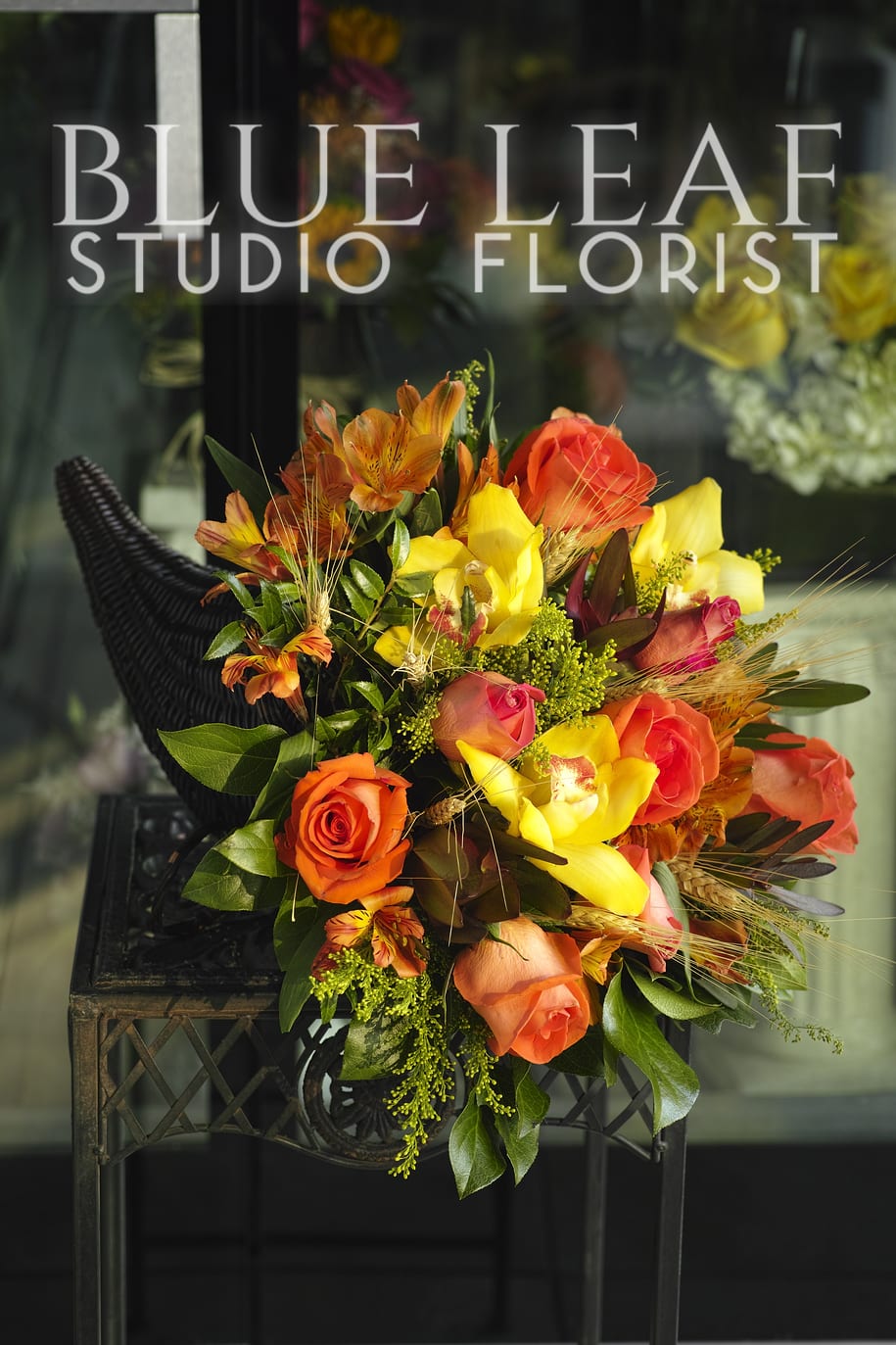 Cornucopia - Medium sized fall colored center with orchids.