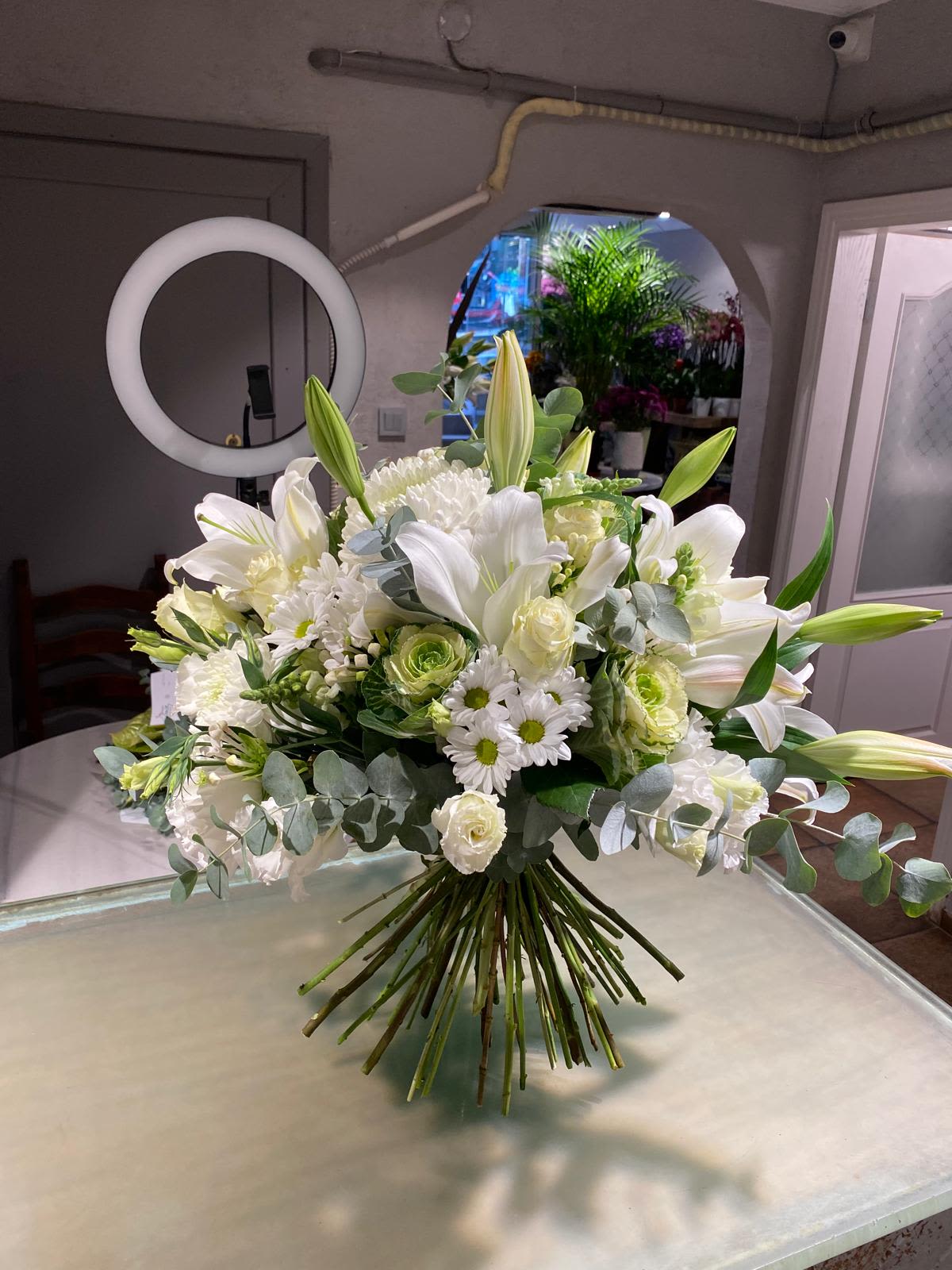 White lily and rose bouquet with daisies and eucalyptus