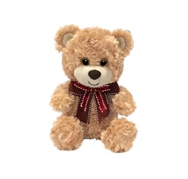 Plush teddy bear with a red ribbon bow