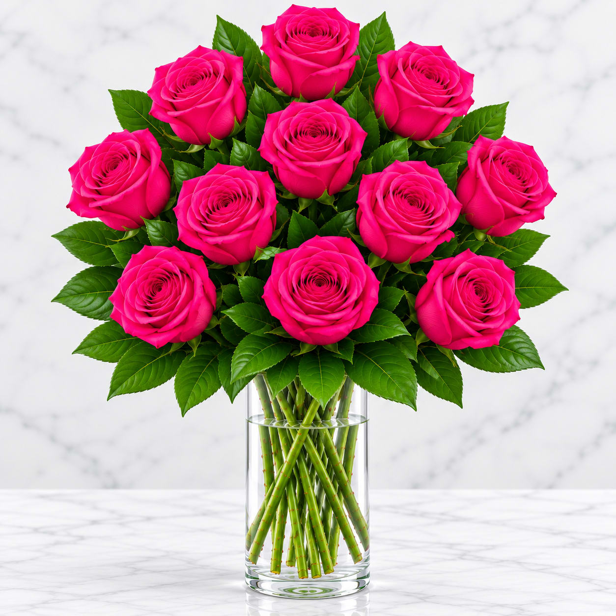 Bouquet of hot pink roses in a clear glass vase