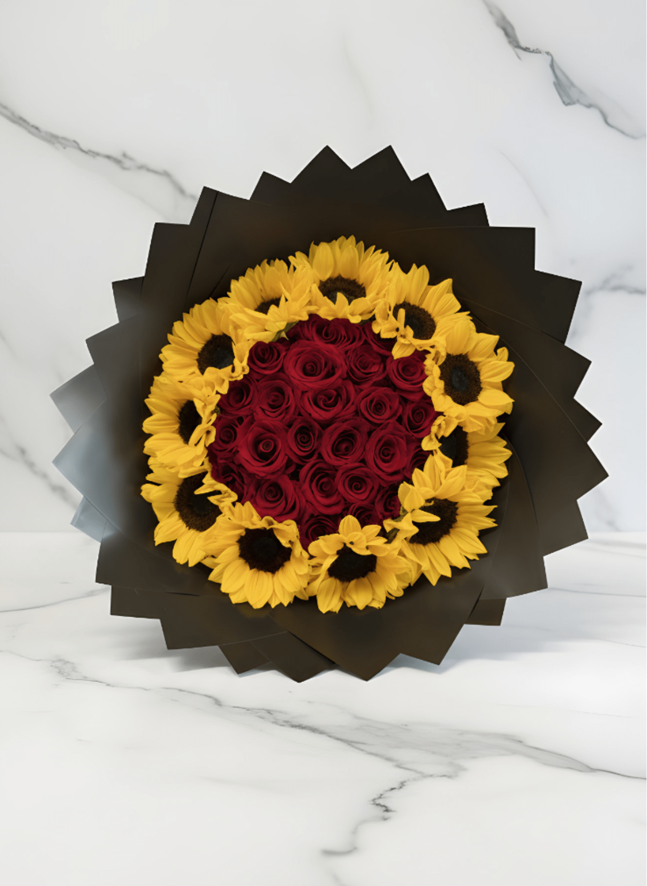 Sunflowers and Roses Bouquet  - Stunning red rose and sunflower bouquet, featuring deep red roses surrounded by vibrant sunflowers and elegant black wrapping. A beautiful choice for romantic occasions, birthdays, anniversaries, celebrations, or simply sending someone special a heartfelt gift. Available for flower delivery and pickup from Mily’s Creations Florist.