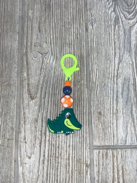 Small crocodile charm with colorful beads on a clip