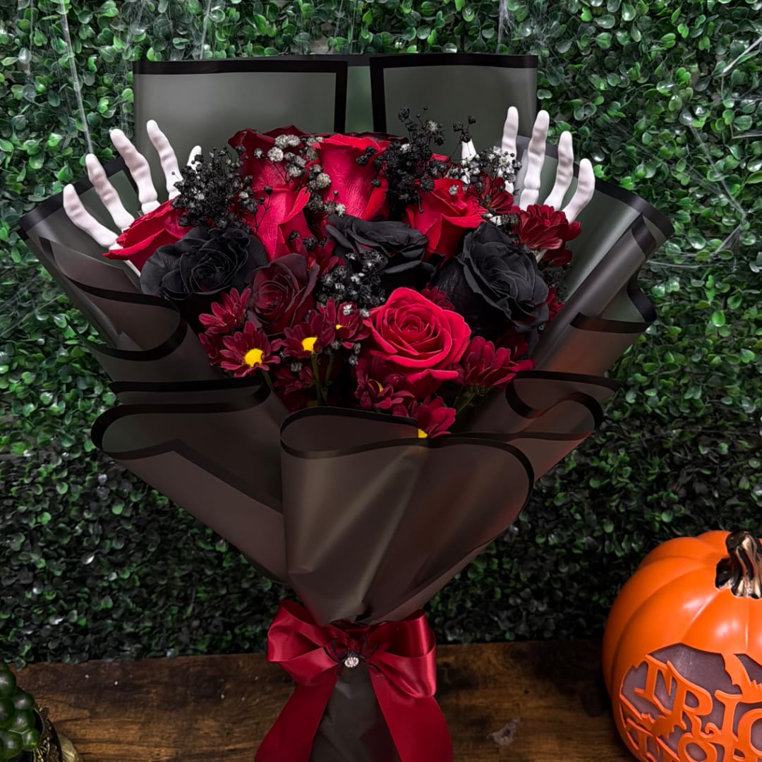 Red and black rose bouquet with a burgundy ribbon