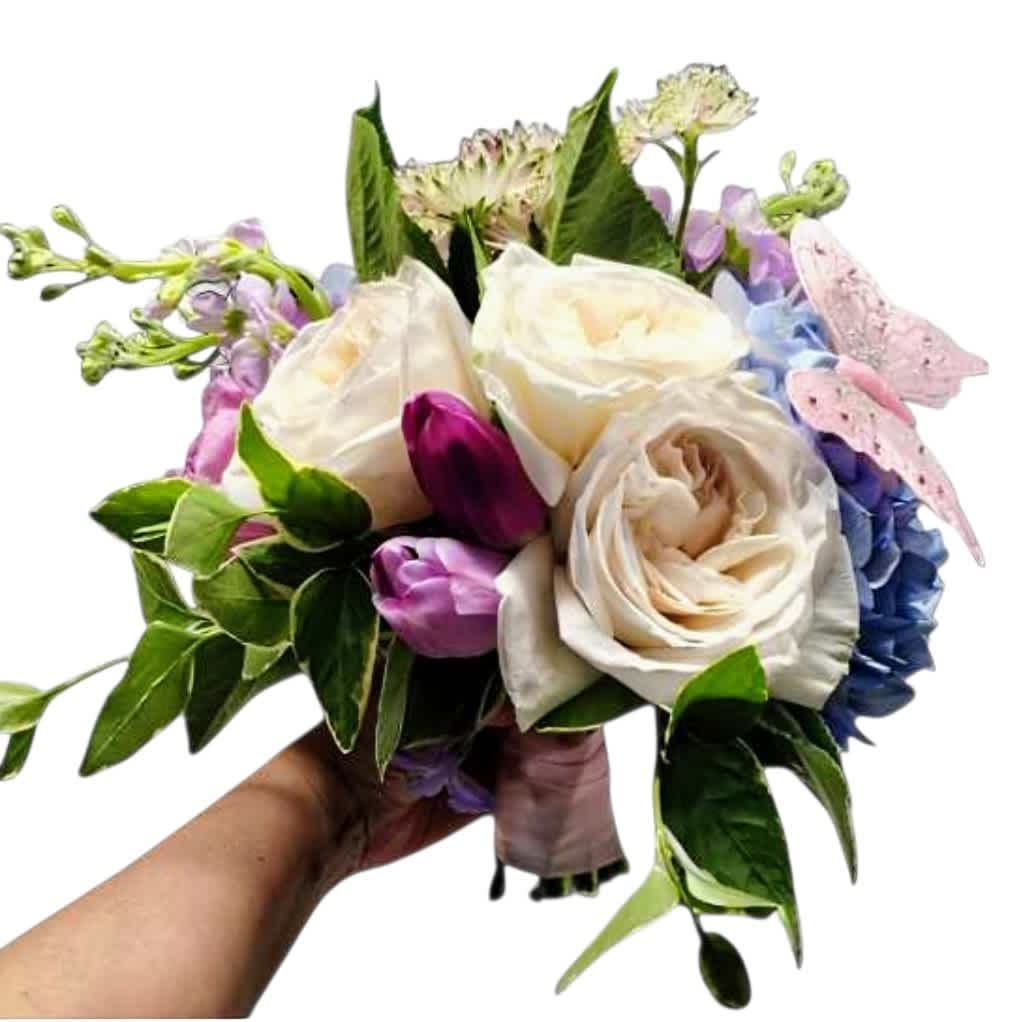 Handheld bouquet of white roses, tulips, and pastel hydrangeas