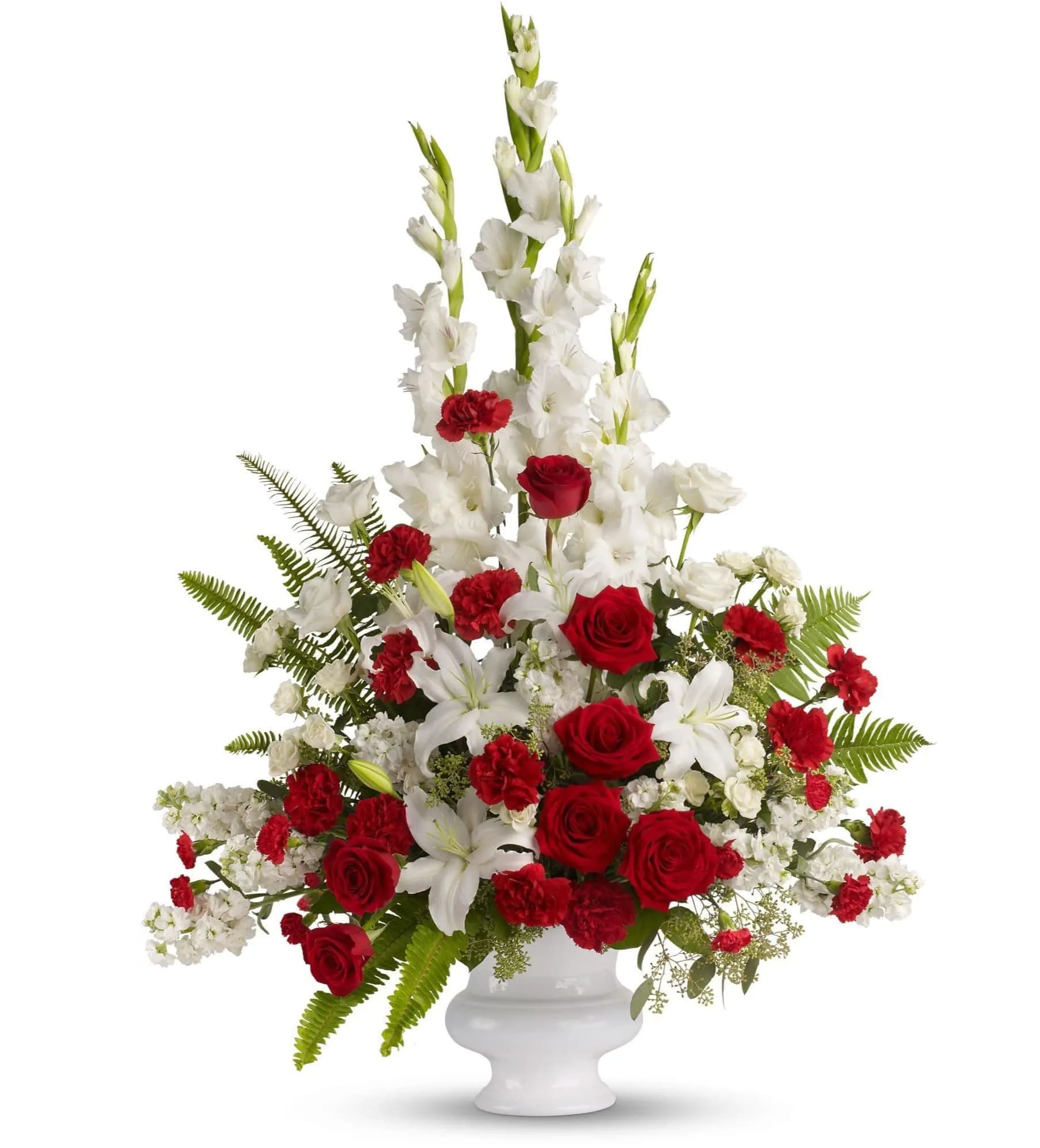 Red roses and white lilies in a white urn vase