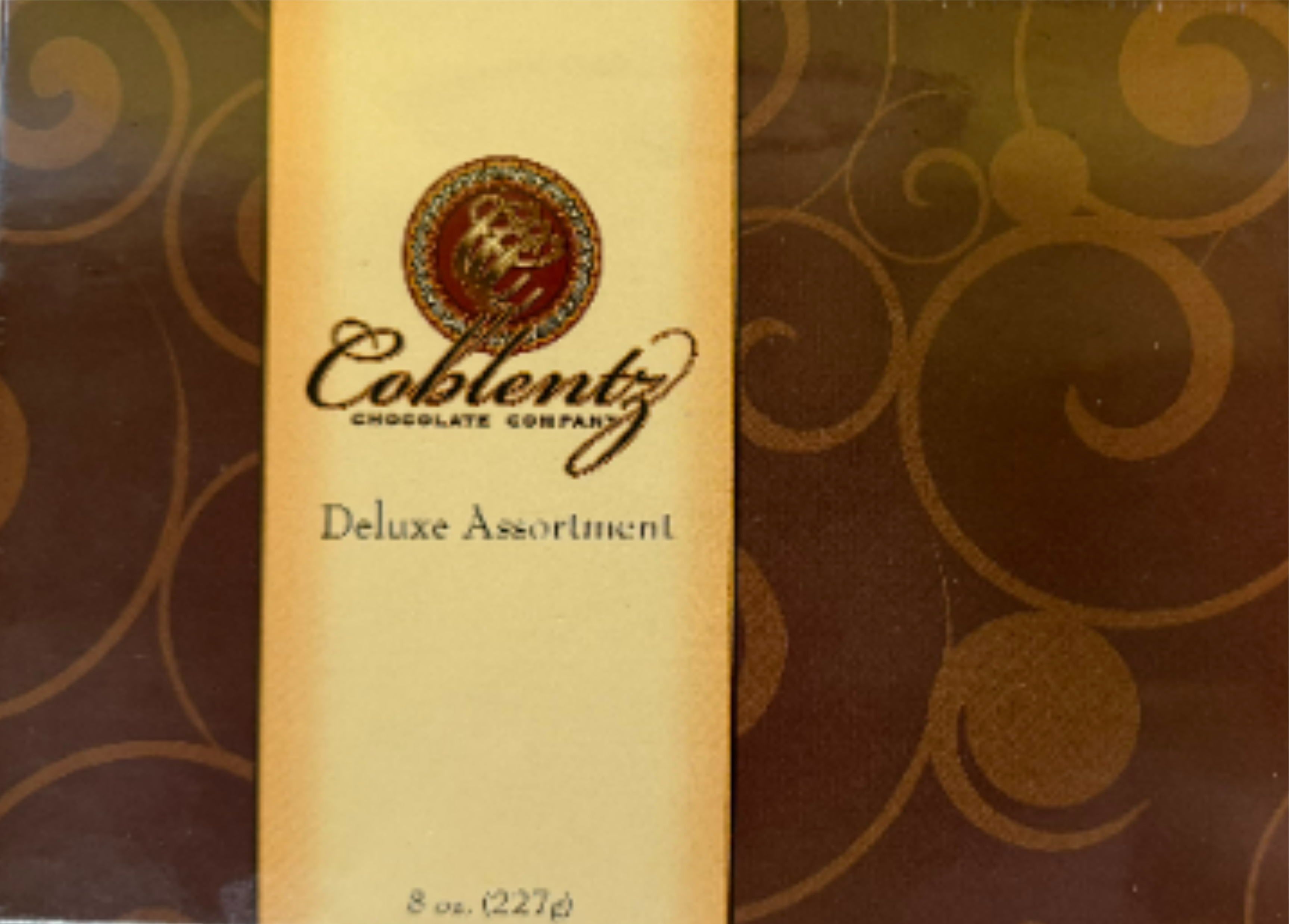Box of assorted chocolates with a gold label