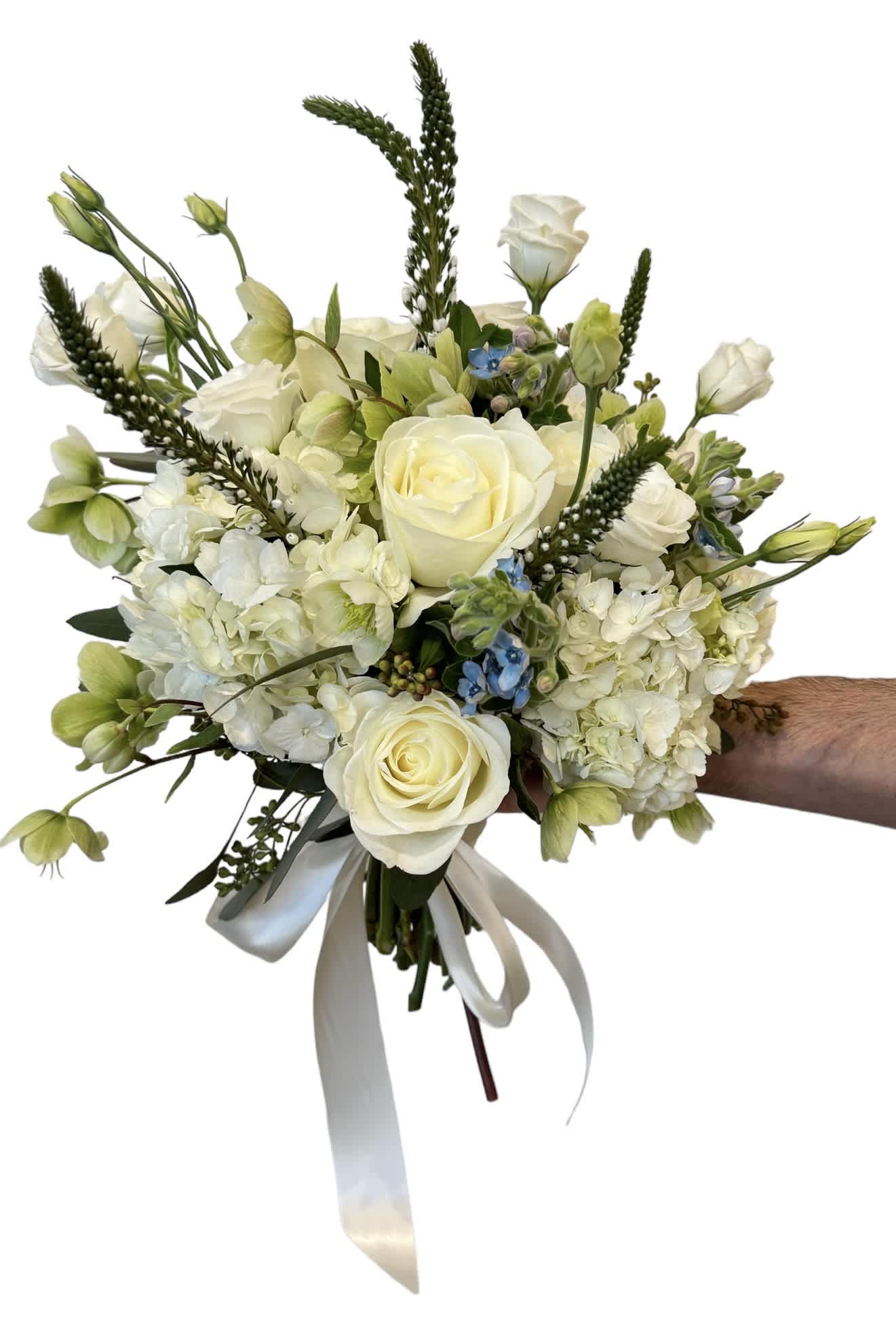 Handheld bouquet of white roses and pale green blooms with a ribbon tie