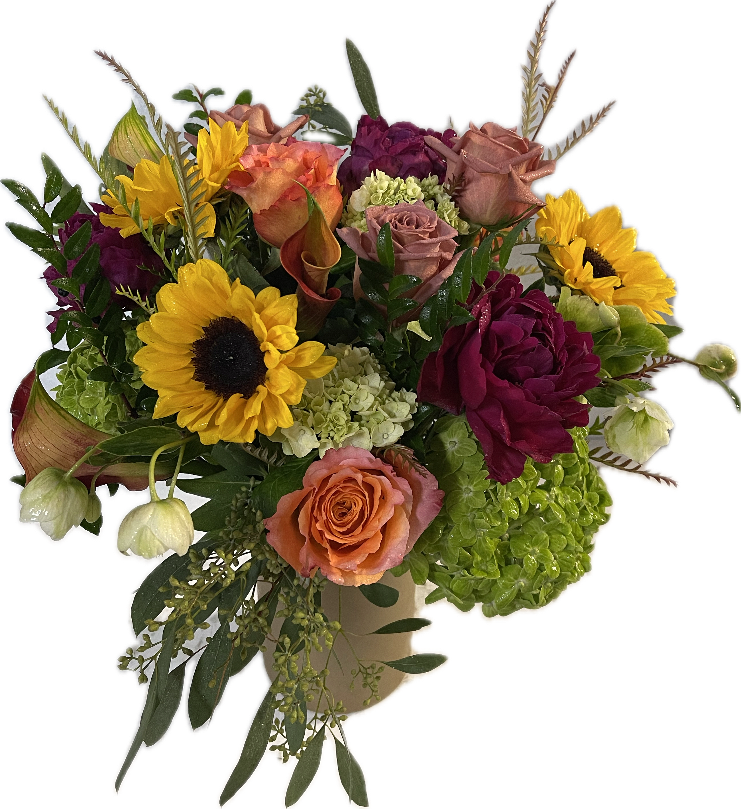 Mixed bouquet with sunflowers, roses, and hydrangeas in a vase