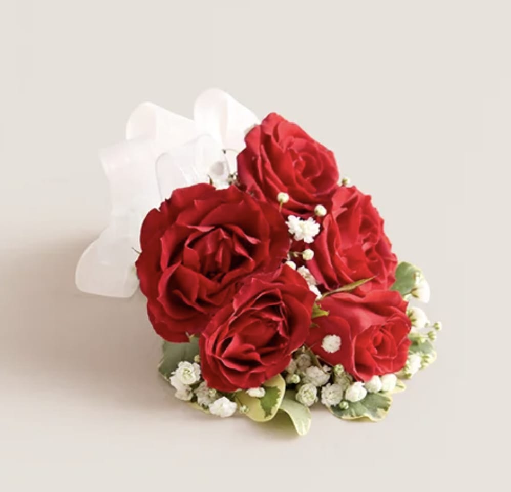 Red rose bouquet with white baby's breath and a white ribbon