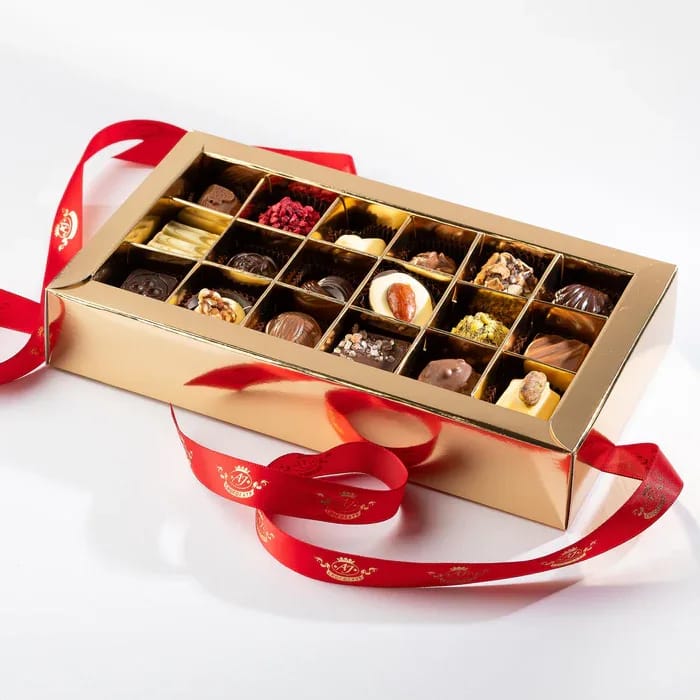 AJ Chocolate House 18pc Window Box - Assortment of Chocolates in a 18pc window box. Inside, they’ll discover gourmet, handcrafted chocolates, made with love and the finest ingredients.
