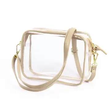 Clear rectangular handbag with beige straps and gold hardware