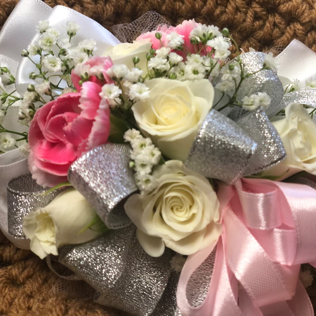 Bouquet of white and pink roses with baby's breath and silver ribbon