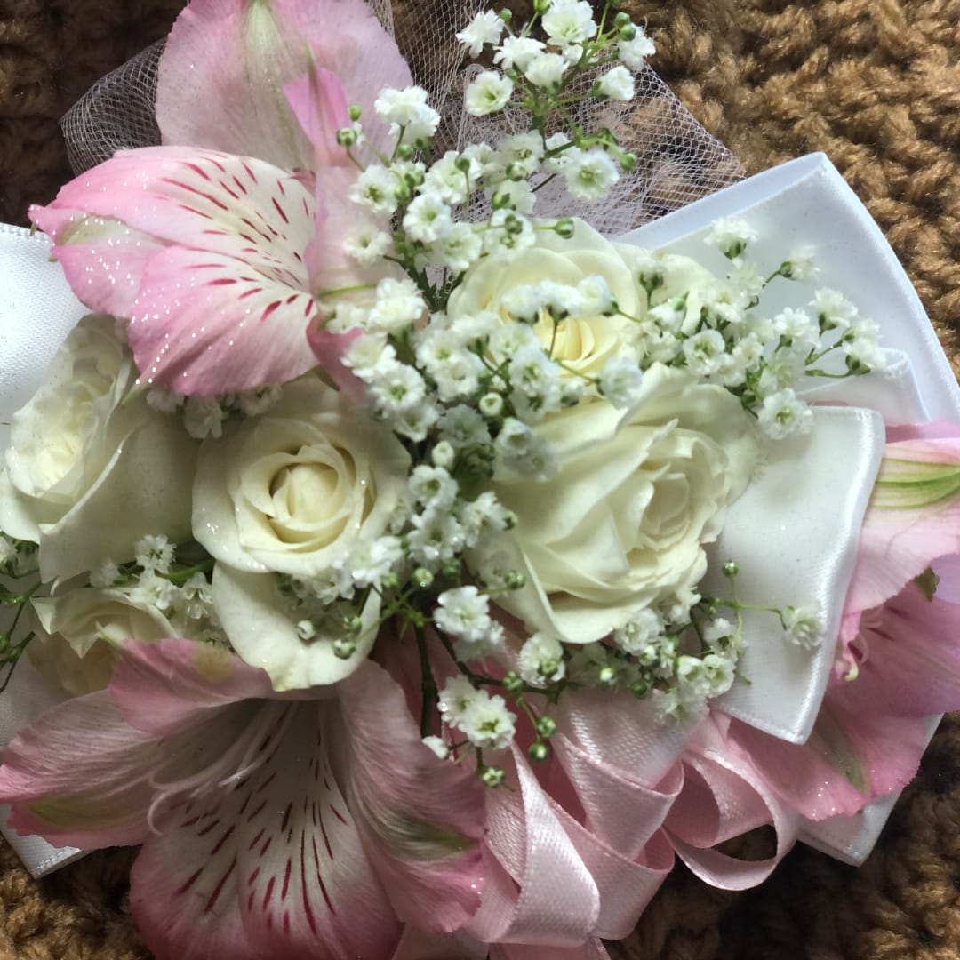 Pink and white bouquet with roses and small white filler flowers