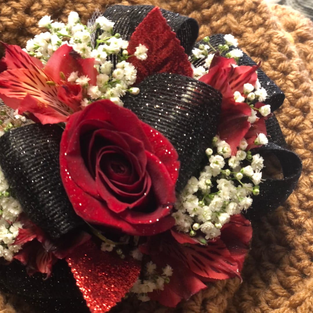 Red rose bouquet with white baby's breath and black ribbon accents