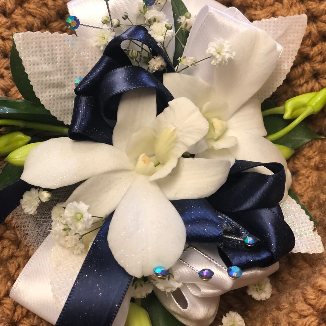 White orchid bouquet with navy and white ribbon accents