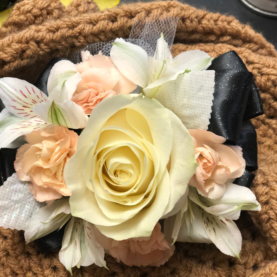 Cream rose with peach carnations and white alstroemeria on black ribbon