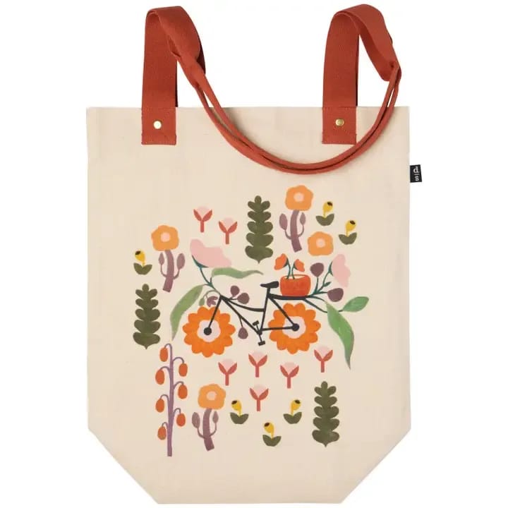 Petal Power Studio Tote - Lightweight yet sturdy, the slender Petal Power studio tote features strong handles with reinforced hardware. Celebrate spring's fleeting beauty with the Petal Power collection. Blossoms branch as you breeze along the bike path, pedaling towards longer, brighter days.  Dimensions: W13 x H16 x D6in / Strap Drop 12.5in  Material: 100% Cotton Care Instructions: Machine wash cold, gentle cycle. Hang to dry.