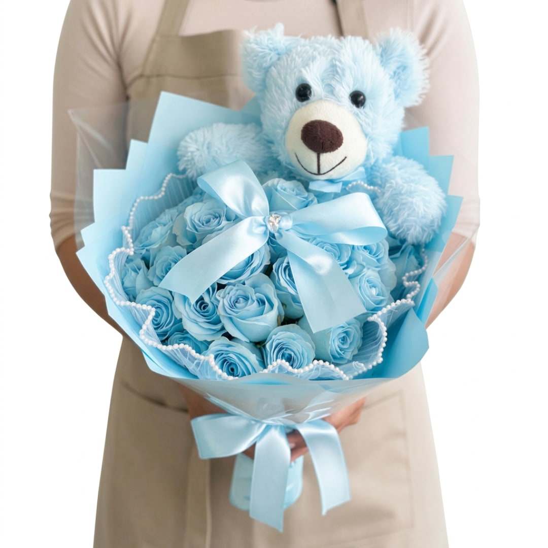 Blue teddy bear with a bouquet of blue roses and ribbon