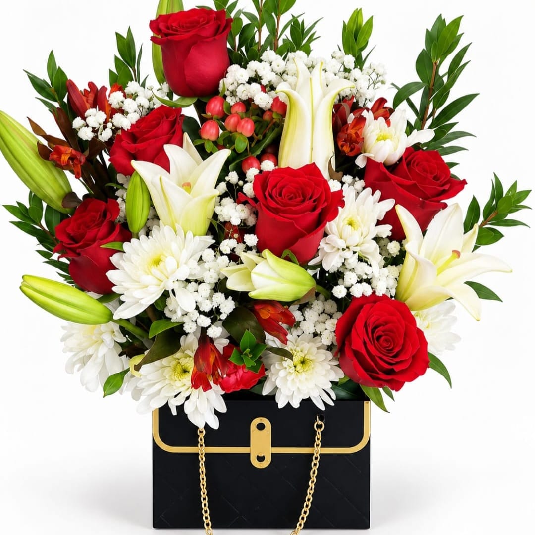 Red roses and white lilies in a black gift box with gold trim