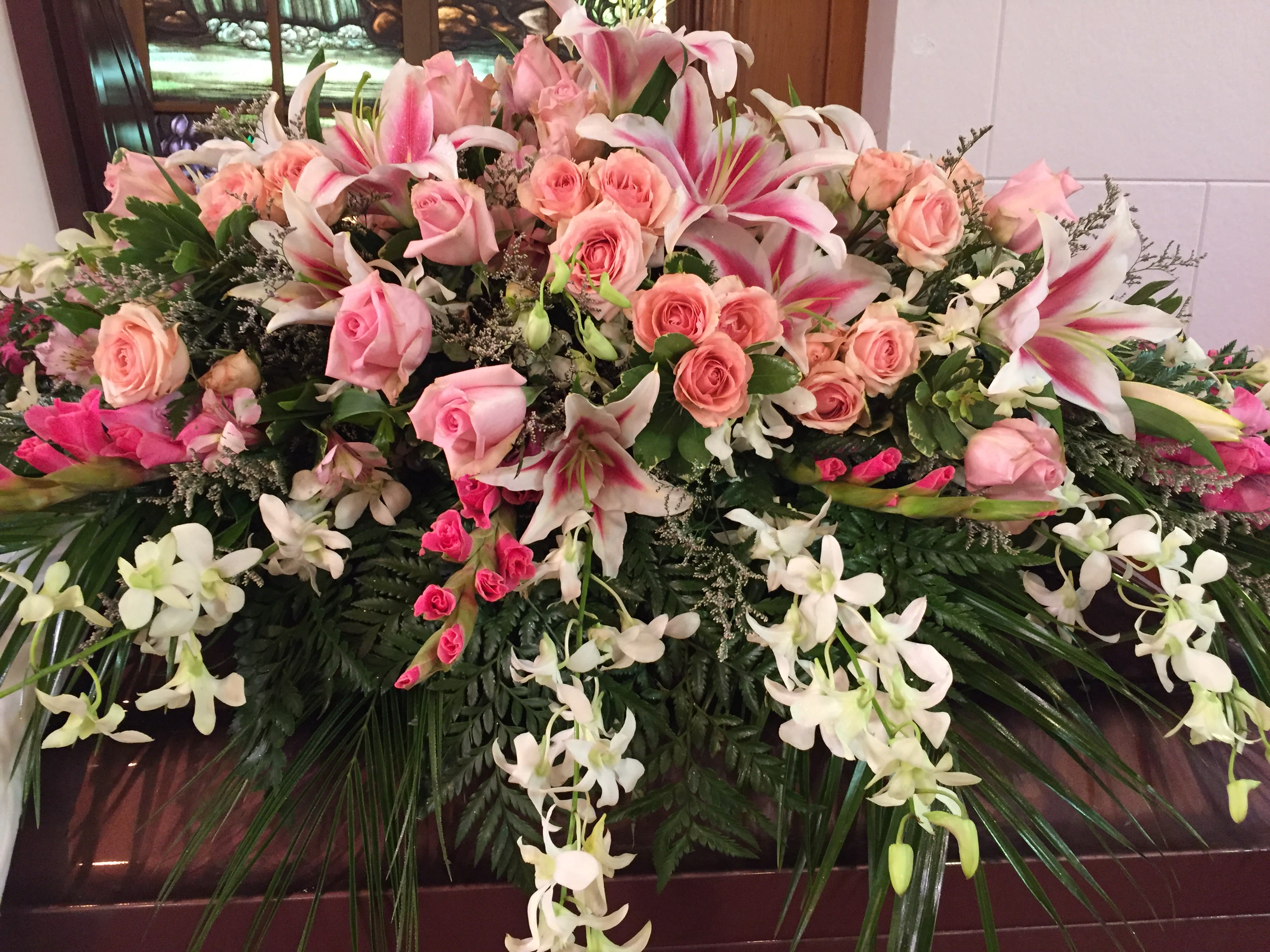 SWEET FOREVER - 42" CASKET SPRAY - PINK ROSES, GLADIOLAS, WHITE ORCHIDS, LILLIES SPECIAL COLOR REQUESTS ALL WHITE FLOWERS