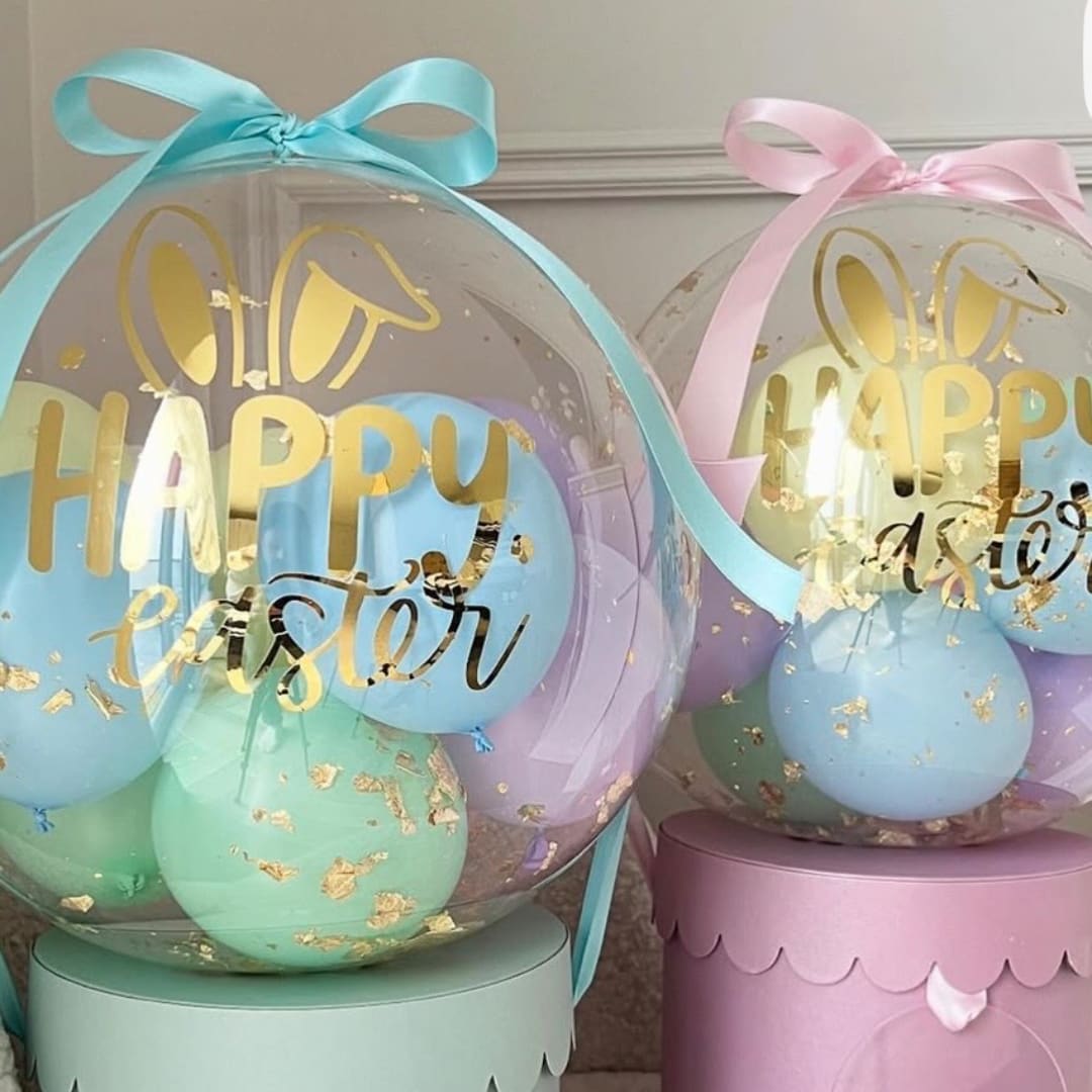 Clear balloons with pastel balloons and gold "Happy Easter" lettering