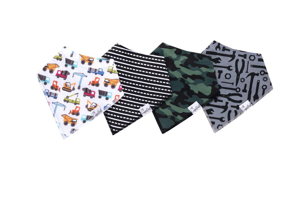 Four patterned bandana bibs laid out on a white background