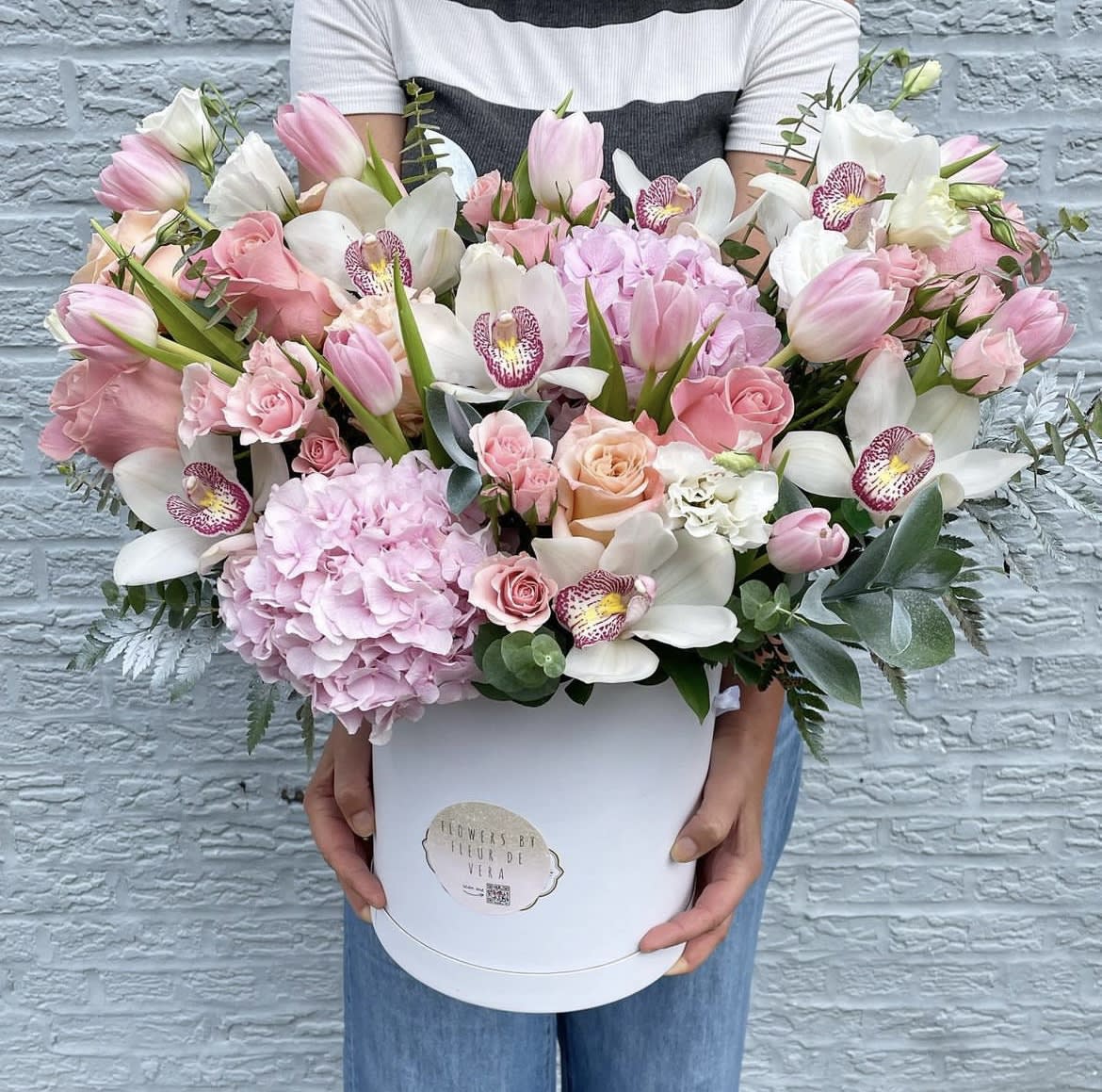 Large pink and white bouquet in a white hat box