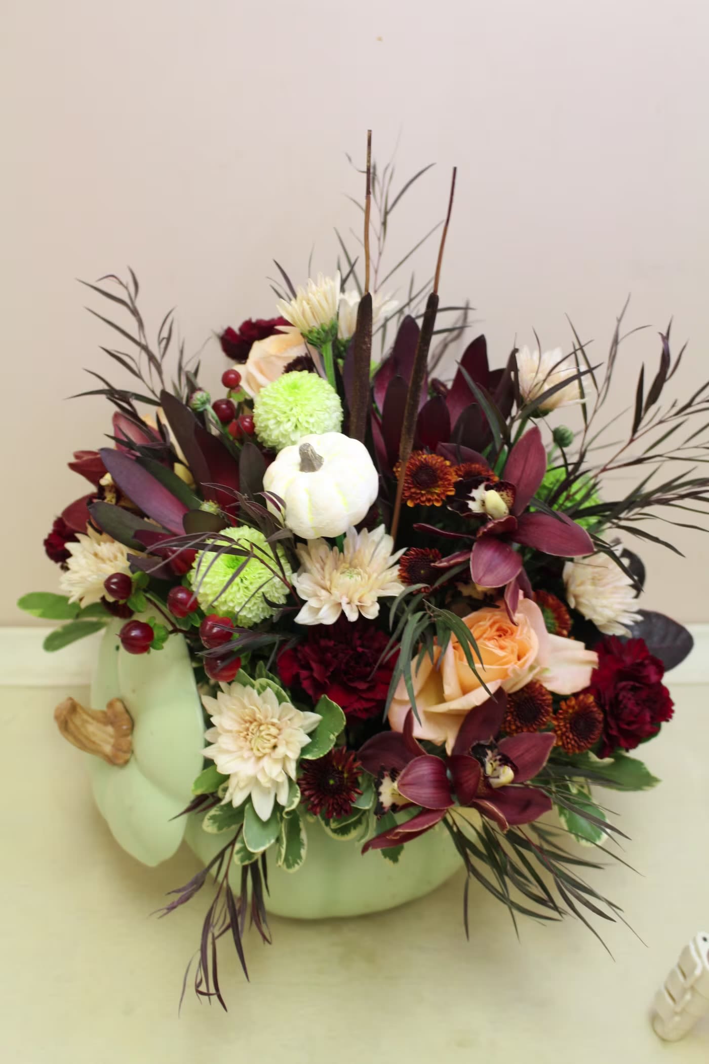 Sweet Sage Pumpkin Bouquet - Bring autumn's charm to your table with Fictitious Flowers Sweet Sage Pumpkin Bouquet, a delightful centerpiece adorned with rustic elegance. Nestled in a timeless hand-painted ceramic pumpkin cookie jar, its exquisite details and warm, earthy hues create a captivating focal 