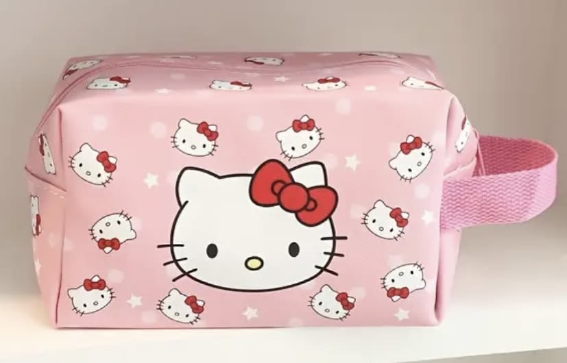 Pink Hello Kitty zippered pouch with a wrist strap