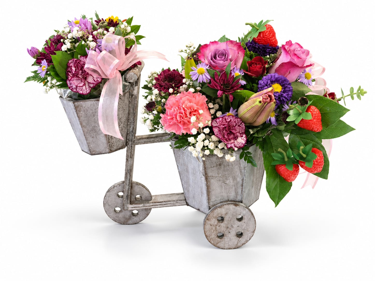 Two flower-filled metal buckets on a small cart with pink ribbons