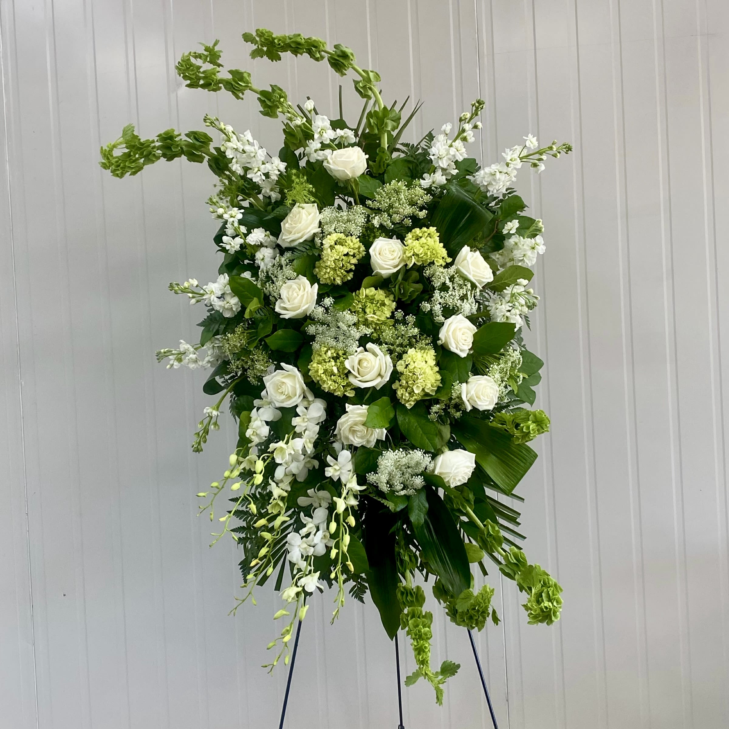 Evergreen Peace Standing Spray - This Standing Spray includes Bells of Ireland, White Queen Anne's Lace, White Dendrobium Orchids, White Rose, White Stock, and Green Mini Hydrangea. Or as Similar as Possible. 