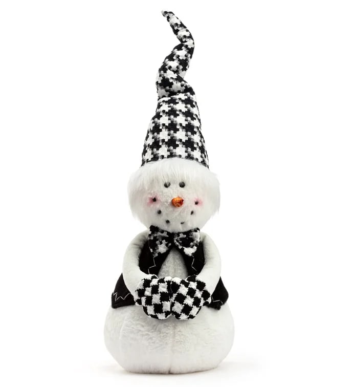 Black-and-white plush snowman figurine with a tall hat and mittens