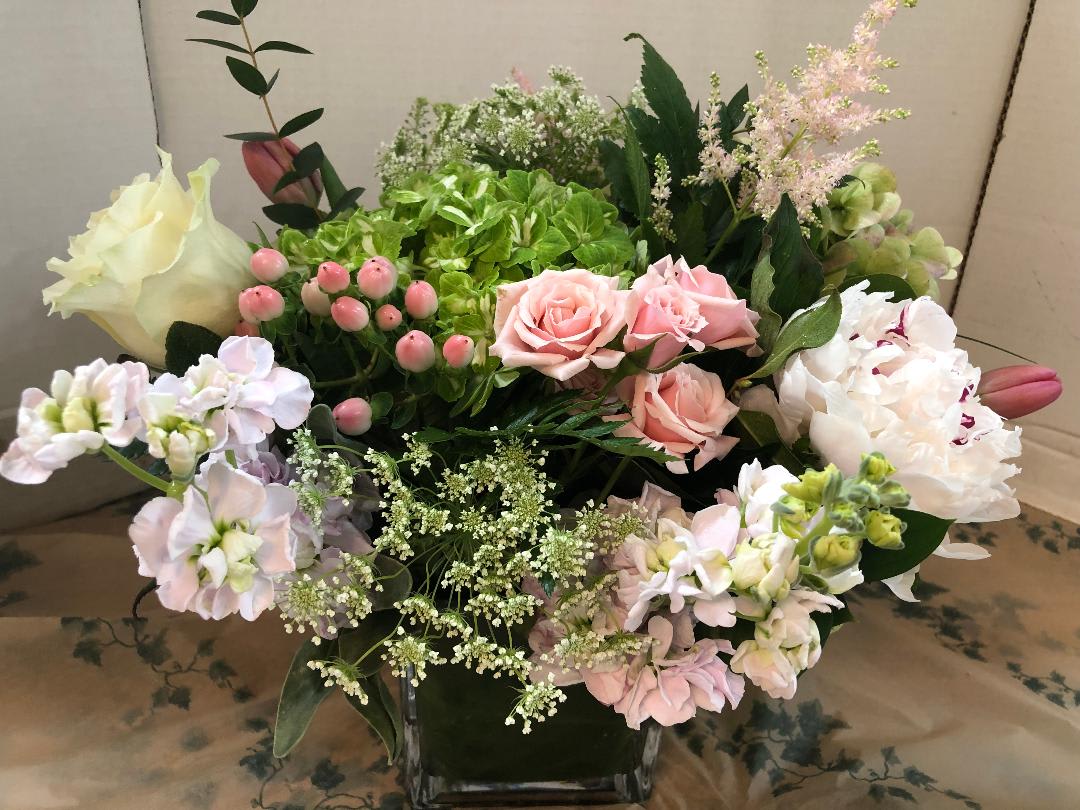 Summer  Party  Arrangement - Peonies(Seasonal), Variety of Hydrangea, Roses, Queen Anne Lace, Tulips(Seasonal). Spray Roses, Astibe, Fancy Greens