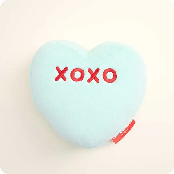 Light blue heart-shaped plush with red "xoxo" embroidery