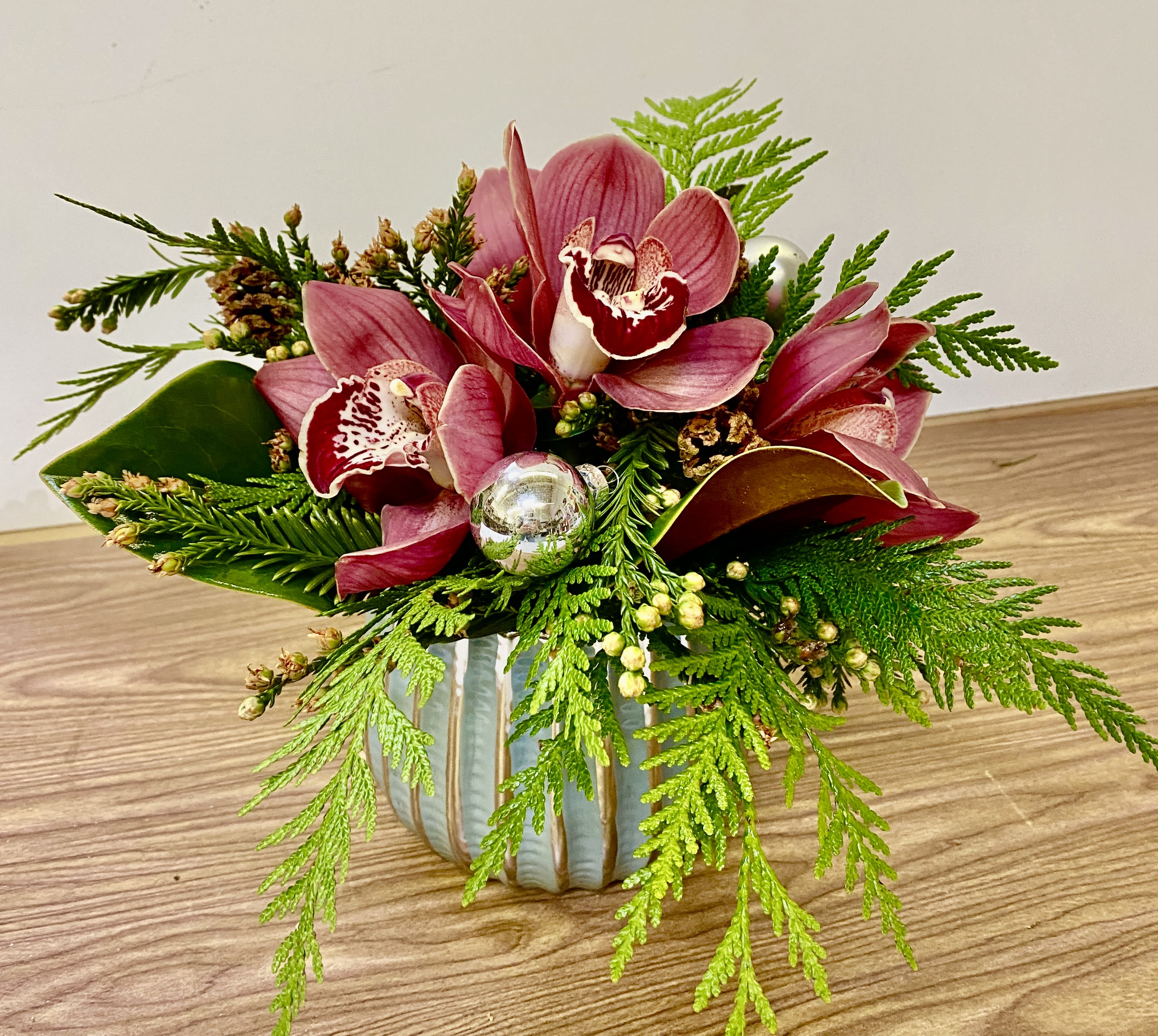 HOT FROSTY -  One arrangement includes a Very nice ceramic vase with XMAS greenery and 3 cymbidium orchids 