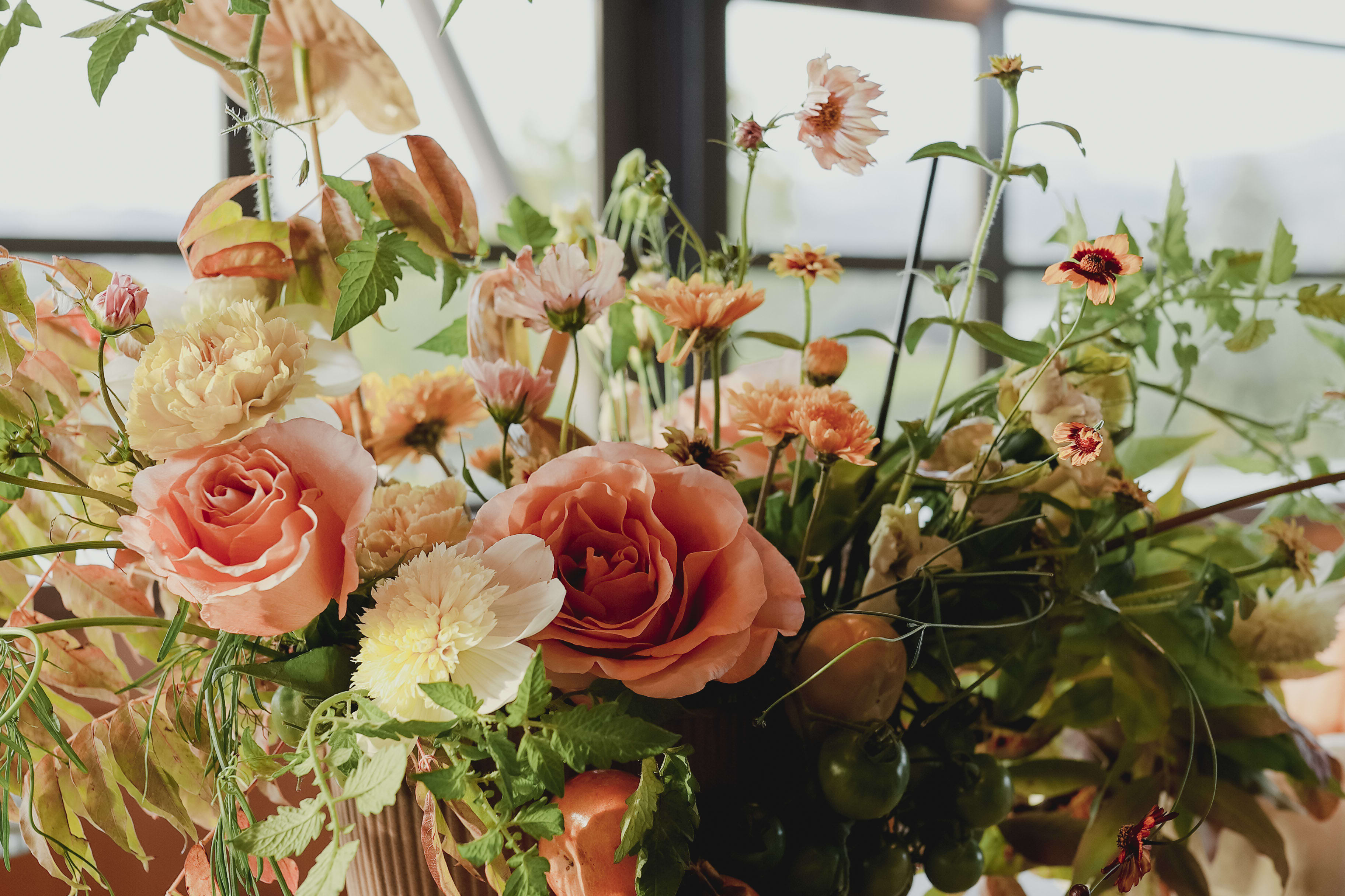 Pinks and yellow arrangement in a bowl vase